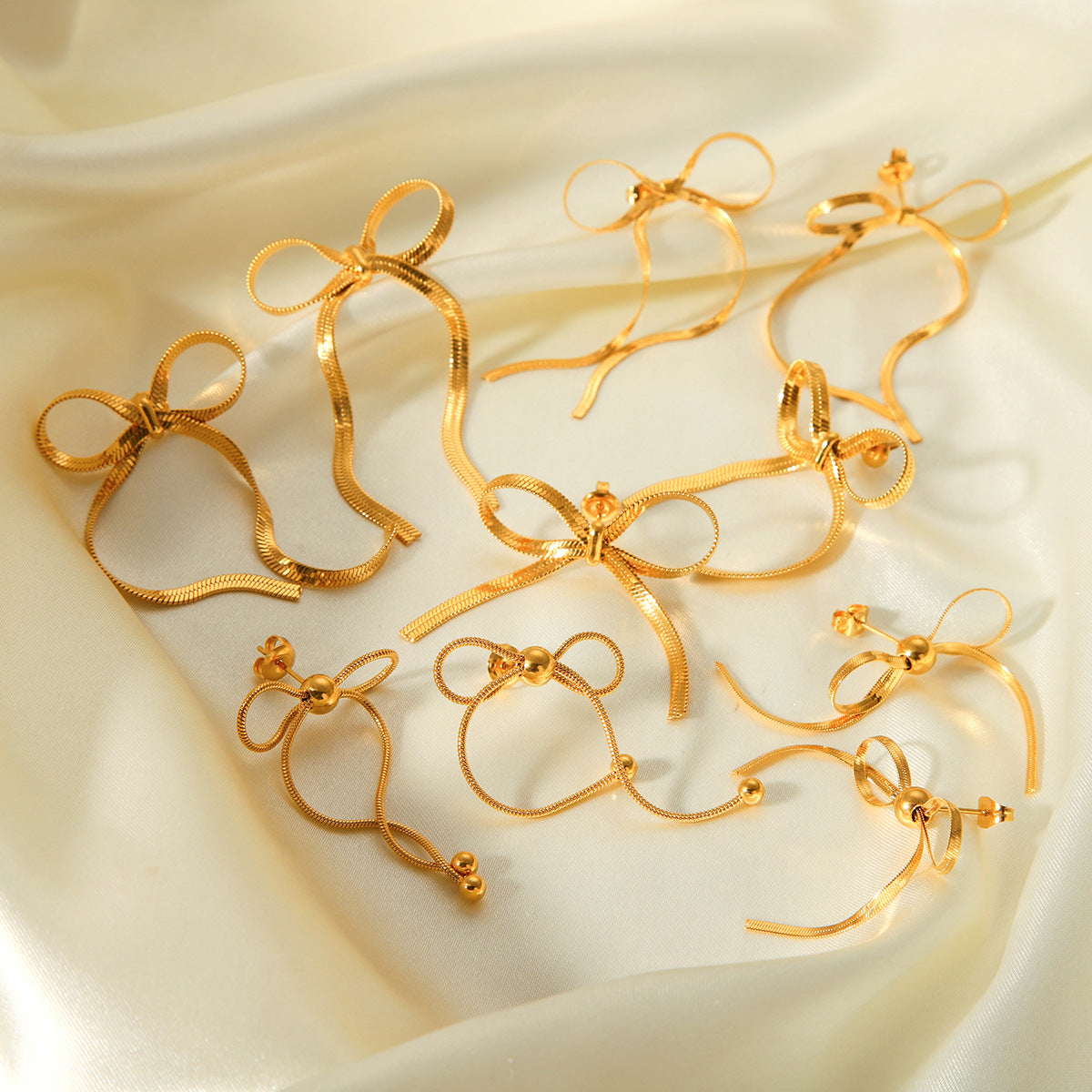 Gold Bow Statement Earrings – 18K Plated Snake Chain Stud Collection